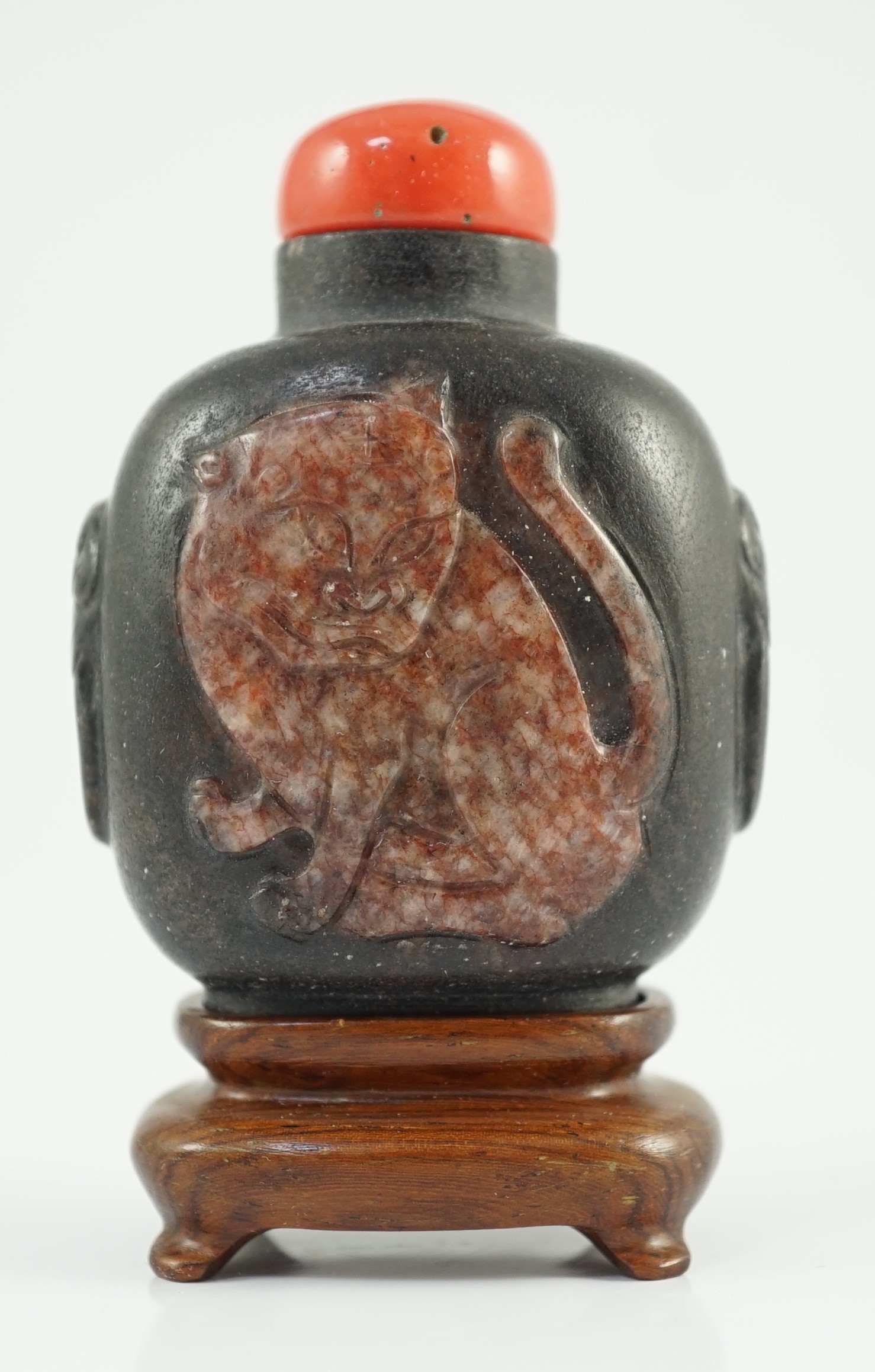 A Chinese two colour marble cameo ‘tiger’ snuff bottle, 19th century, 5.4cm high